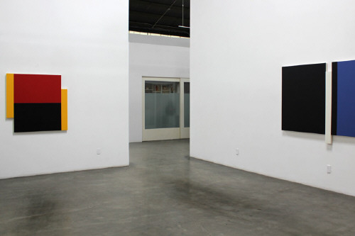 Artist: Scot Heywood, Title: Installation View left to right: Poles Yellow, Red, Blue, 2012; Sunyata Black, Blue, White, 2012 - click for larger image