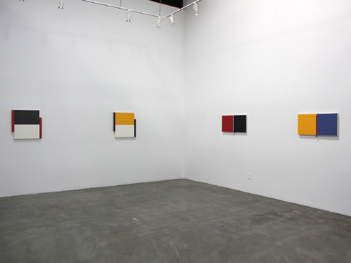 Artist: Scot Heywood, Title: Installation view of Scot Heywood: A Survey of Small Paintings. (From left to right) Poles, Black, White, Red, 2012, Poles Yellow, White, Black, 2012, Un Deux Trois Red, Gray, Black, 2006, and Un Deux Trois Yellow, Red, Blue, 2006. - click for larger image